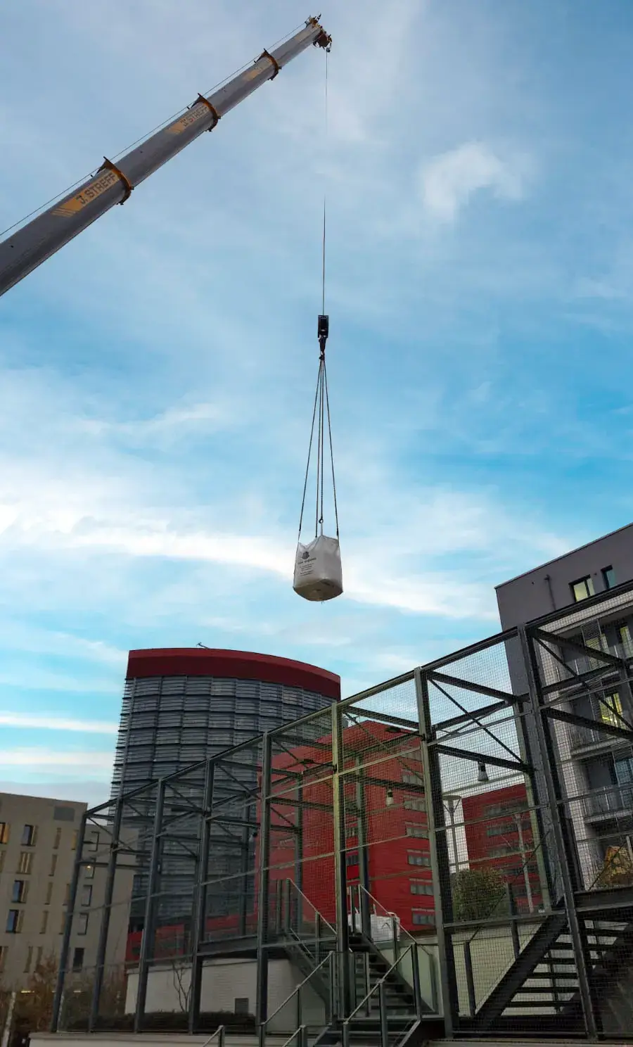 Material transport by crane